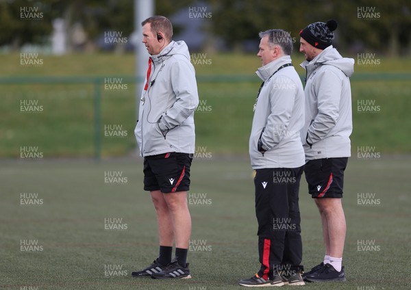 070323 - Wales Women Rugby Training Session - Head coach Ioan Cunningham, left,  attack coach Shaun Connor and defence coach  Mike Hill during training session