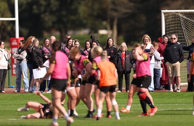 070426 - Wales Women Rugby Squad - Competition winners watch the Wales Women training session ahead of the opening Women’s 6 Nations match against Scotland
