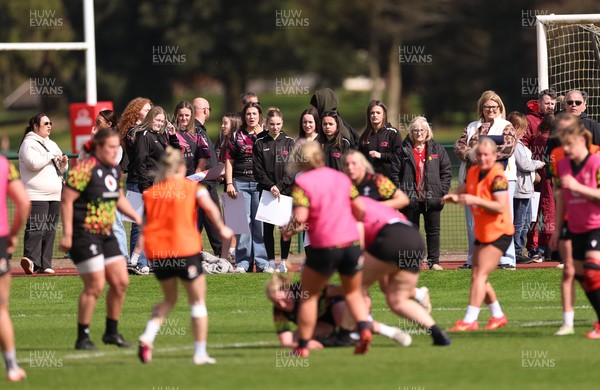 070426 - Wales Women Rugby Squad - Competition winners watch the Wales Women training session ahead of the opening Women’s 6 Nations match against Scotland