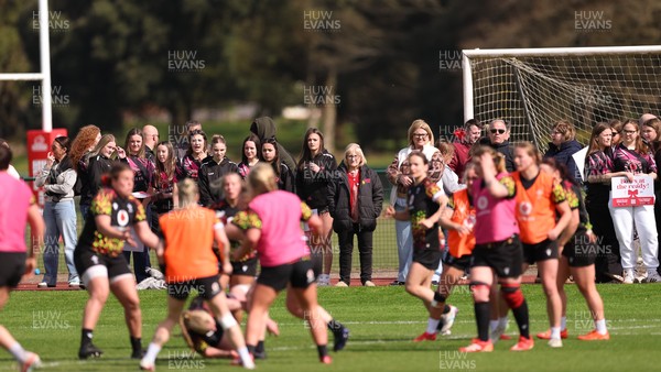 070426 - Wales Women Rugby Squad - Competition winners watch the Wales Women training session ahead of the opening Women’s 6 Nations match against Scotland