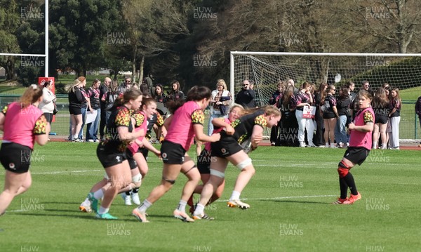 070426 - Wales Women Rugby Squad - Competition winners watch the Wales Women training session ahead of the opening Women’s 6 Nations match against Scotland