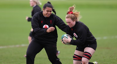 080424 - Wales Women Rugby Training Session - Sisilia Tuipulotu and Abbie Fleming during a training session ahead of Wales’ Women’s 6 Nations match against Ireland