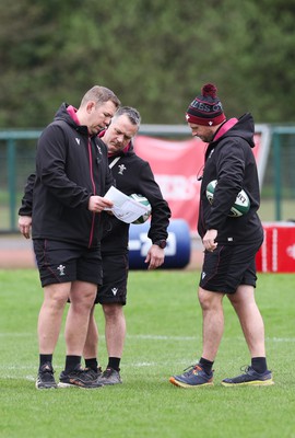 080424 - Wales Women Rugby Training Session - Left to right, Ioan Cunningham, Wales Women head coach,, Shaun Connor, Wales Women attack coach, and Mike Hill, Wales Women forwards coach during a training session ahead of Wales’ Women’s 6 Nations match against Ireland