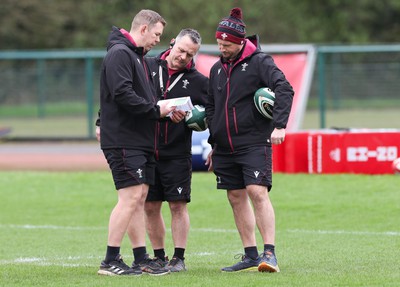 080424 - Wales Women Rugby Training Session - Left to right, Ioan Cunningham, Wales Women head coach,, Shaun Connor, Wales Women attack coach, and Mike Hill, Wales Women forwards coach during a training session ahead of Wales’ Women’s 6 Nations match against Ireland