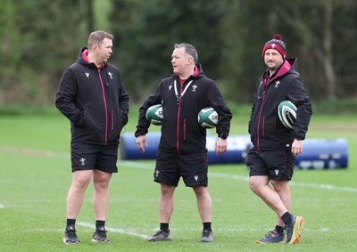 080424 - Wales Women Rugby Training Session - Left to right, Ioan Cunningham, Wales Women head coach,, Shaun Connor, Wales Women attack coach, and Mike Hill, Wales Women forwards coach during a training session ahead of Wales’ Women’s 6 Nations match against Ireland