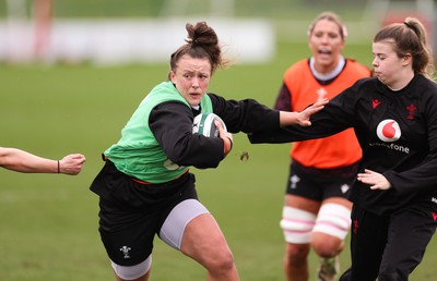 080424 - Wales Women Rugby Training Session - Lleucu George is held by Mollie Wilkinson during a training session ahead of Wales’ Women’s 6 Nations match against Ireland