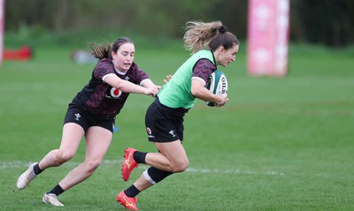 080424 - Wales Women Rugby Training Session - Jasmine Joyce gets away from Nel Metcalfe during a training session ahead of Wales’ Women’s 6 Nations match against Ireland