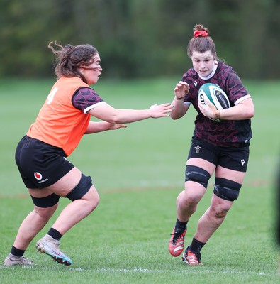 080424 - Wales Women Rugby Training Session - Kate Williams takes on Gwennan Hopkins during a training session ahead of Wales’ Women’s 6 Nations match against Ireland