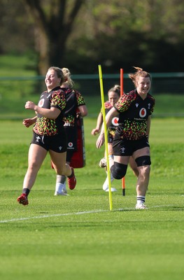 080426 - Wales Women Rugby Squad - Molly Reardon and Kate Williams warm up during training session ahead of the opening Women’s 6 Nations match against Scotland