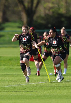 080426 - Wales Women Rugby Squad - Kate Williams and Sisilia Tuipulotu warm up during training session ahead of the opening Women’s 6 Nations match against Scotland