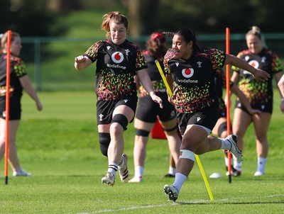 080426 - Wales Women Rugby Squad - Kate Williams and Sisilia Tuipulotu warm up during training session ahead of the opening Women’s 6 Nations match against Scotland
