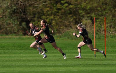 080426 - Wales Women Rugby Squad - Catherine Richards, Carys Cox and Keira Bevan warm up during training session ahead of the opening Women’s 6 Nations match against Scotland