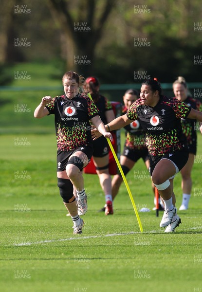 080426 - Wales Women Rugby Squad - Kate Williams and Sisilia Tuipulotu warm up during training session ahead of the opening Women’s 6 Nations match against Scotland