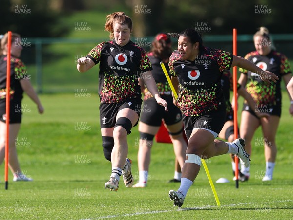 080426 - Wales Women Rugby Squad - Kate Williams and Sisilia Tuipulotu warm up during training session ahead of the opening Women’s 6 Nations match against Scotland