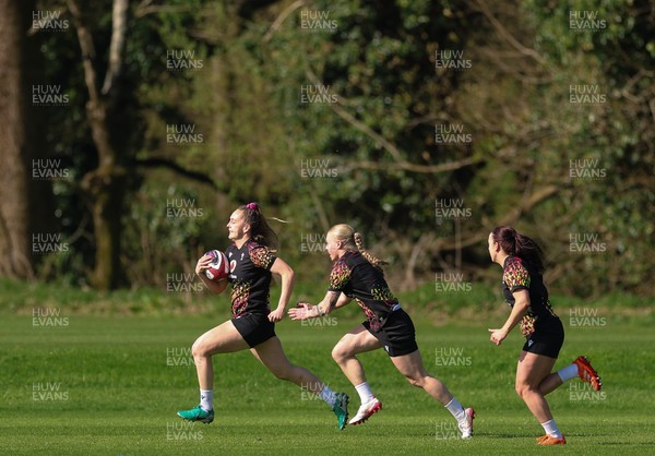 080426 - Wales Women Rugby Squad - Hannah Dallavalle, Nikita Prothero and Sian Jones warm up during training session ahead of the opening Women’s 6 Nations match against Scotland
