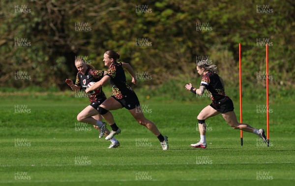 080426 - Wales Women Rugby Squad - Catherine Richards, Carys Cox and Keira Bevan warm up during training session ahead of the opening Women’s 6 Nations match against Scotland