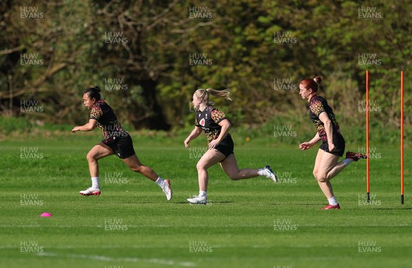 080426 - Wales Women Rugby Squad - Jenna De Vera, Seren Lockwood and Lisa Neumann during training session ahead of the opening Women’s 6 Nations match against Scotland