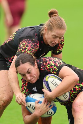 080926 - Wales Women Rugby Training - Lisa Neumann and Courtney Keight during a rugby session ahead of the WXV Series of matches