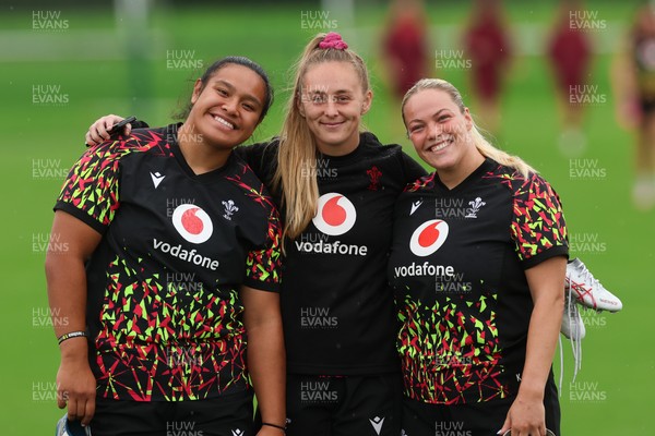 080926 - Wales Women Rugby Training - Sisilia Tuipulotu, Hannah Dallavalle and Kelsey Jones during a rugby session ahead of the WXV Series of matches