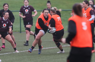 100424 - Wales Women Rugby Training - Lleucu George charges forward during a training session ahead of Wales’ Women’s 6 Nations match against Ireland