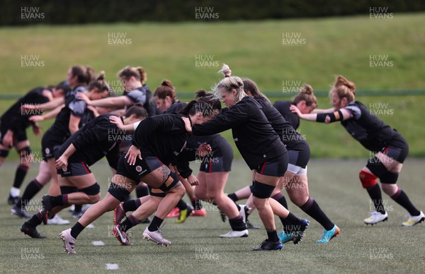 110423 - Wales Women Rugby Training Session - The Wales Women squad warm up during a training session ahead of the TicTok Women’s 6 Nations match against England