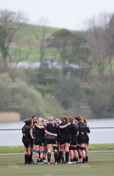 110423 - Wales Women Rugby Training Session - The Wales Women squad huddle during a training session ahead of the TicTok Women’s 6 Nations match against England