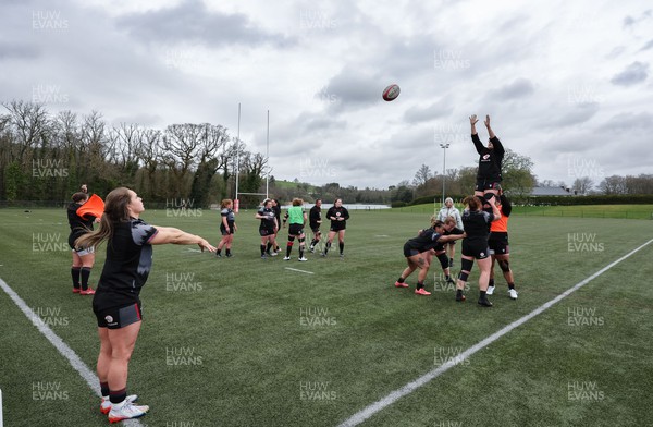 110423 - Wales Women Rugby Training Session - Kat Evans runs through line out throws during a training session ahead of the TicTok Women’s 6 Nations match against England