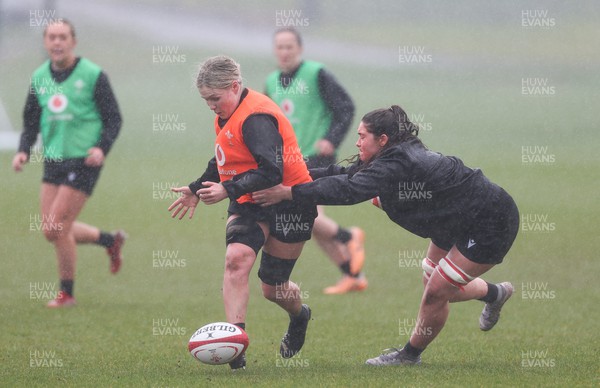 120324 - Wales Women Training session - Alex Callender gets past Gwennan Hopkins during training session ahead of the start of the Women’s 6 Nations