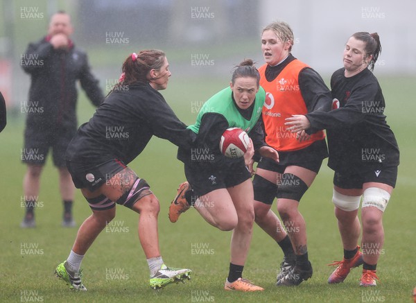 120324 - Wales Women Training session - Jenny Hesketh takes on Georgia Evans, Alex Callender and Kate Williams during training session ahead of the start of the Women’s 6 Nations