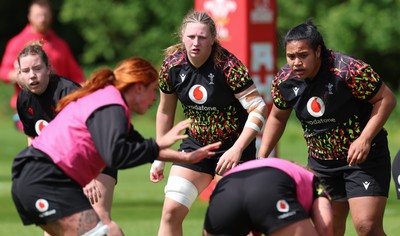 130526 - Wales Women Rugby Training - Sisilia Tuipulotu and Alaw Pyrs during a rugby training session ahead of their final Women’s 6 Nations match against Italy