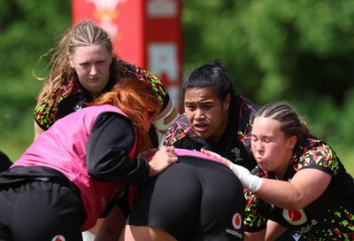 130526 - Wales Women Rugby Training - Katherine Baverstock, Sisilia Tuipulotu and Alaw Pyrs during a rugby training session ahead of their final Women’s 6 Nations match against Italy