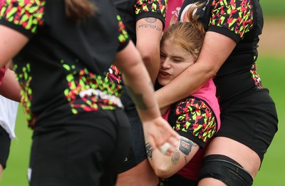 140426 - Wales Women Rugby Training - Bethan Lewis is held by Alaw Pyrs during a rugby training session ahead of the Women’s 6 Nations match against France