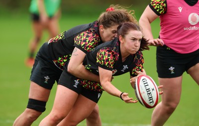 140426 - Wales Women Rugby Training - Sian Jones is tackled by Natalia John during a rugby training session ahead of the Women’s 6 Nations match against France