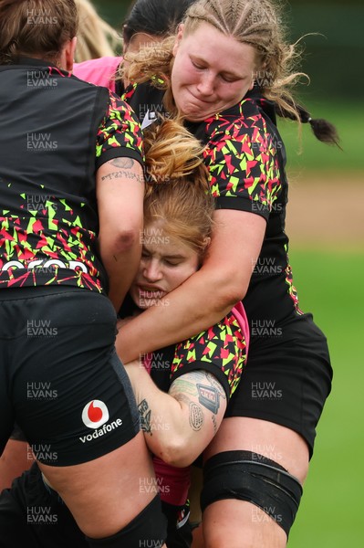 140426 - Wales Women Rugby Training - Bethan Lewis is held by Alaw Pyrs during a rugby training session ahead of the Women’s 6 Nations match against France