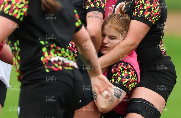 140426 - Wales Women Rugby Training - Bethan Lewis is held by Alaw Pyrs during a rugby training session ahead of the Women’s 6 Nations match against France