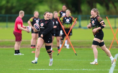 140526 - Wales Women Rugby Training - Jenni Scoble warms up during a rugby training session ahead of their final Women’s 6 Nations match against Italy