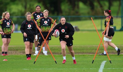 140526 - Wales Women Rugby Training - Kendall Waudby warms up during a rugby training session ahead of their final Women’s 6 Nations match against Italy