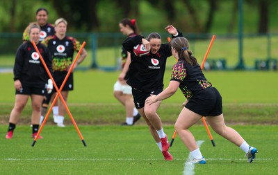 140526 - Wales Women Rugby Training - Kendall Waudby warms up during a rugby training session ahead of their final Women’s 6 Nations match against Italy