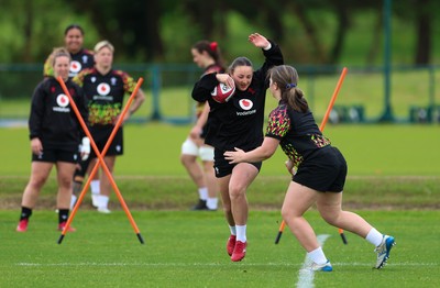 140526 - Wales Women Rugby Training - Kendall Waudby warms up during a rugby training session ahead of their final Women’s 6 Nations match against Italy
