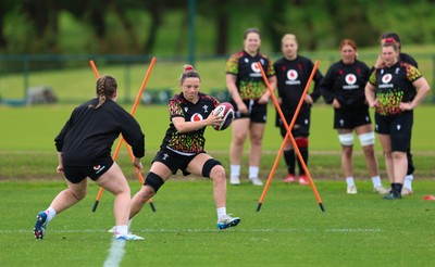 140526 - Wales Women Rugby Training - Alisha Joyce warms up during a rugby training session ahead of their final Women’s 6 Nations match against Italy