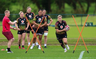 140526 - Wales Women Rugby Training - Donna Rose warms up during a rugby training session ahead of their final Women’s 6 Nations match against Italy