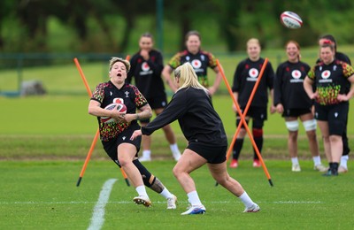 140526 - Wales Women Rugby Training - Donna Rose warms up during a rugby training session ahead of their final Women’s 6 Nations match against Italy