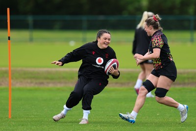 140526 - Wales Women Rugby Training - Jorja Aiono warms up during a rugby training session ahead of their final Women’s 6 Nations match against Italy
