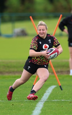 140526 - Wales Women Rugby Training - Molly Reardon warms up during a rugby training session ahead of their final Women’s 6 Nations match against Italy