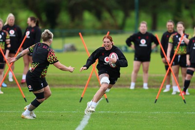 140526 - Wales Women Rugby Training - Georgia Evans warms up during a rugby training session ahead of their final Women’s 6 Nations match against Italy