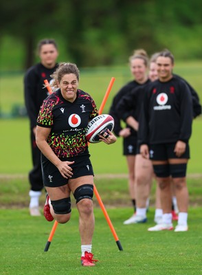 140526 - Wales Women Rugby Training - Natalia John warms up during a rugby training session ahead of their final Women’s 6 Nations match against Italy