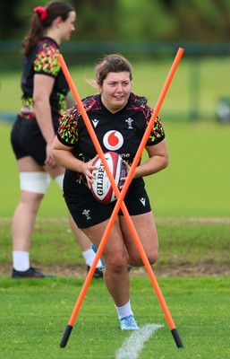 140526 - Wales Women Rugby Training - Stella Orrin warms up during a rugby training session ahead of their final Women’s 6 Nations match against Italy