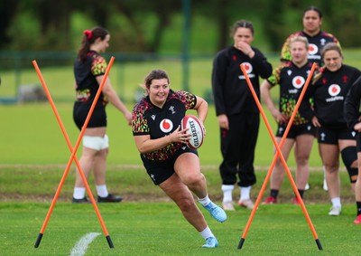 140526 - Wales Women Rugby Training - Stella Orrin warms up during a rugby training session ahead of their final Women’s 6 Nations match against Italy