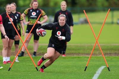 140526 - Wales Women Rugby Training - Katherine Baverstock warms up during a rugby training session ahead of their final Women’s 6 Nations match against Italy