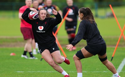 140526 - Wales Women Rugby Training - Kendall Waudby warms up during a rugby training session ahead of their final Women’s 6 Nations match against Italy
